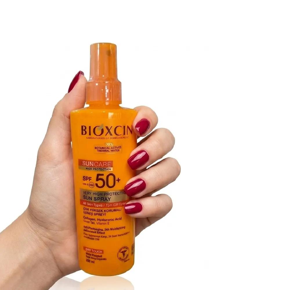 اسپری ضد آفتاب بی‌رنگ بیوکسین SPF 50 مدل High protection ‌محافظ UVA/UVB مناسب برای انواع پوست حجم 200 میلی‌لیتر — تصویر ۲